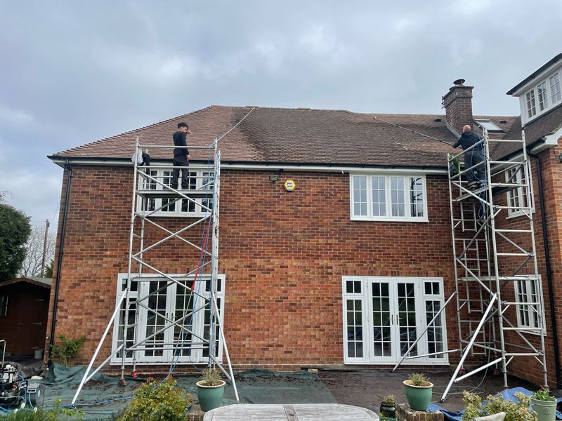 Roof cleaning carried out safely from scaffold towers by The Roof Moss Cleaners in Brackley